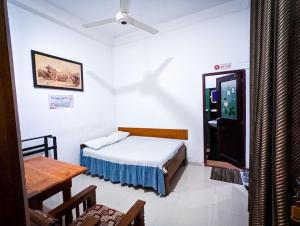 Rúm í herbergi á Hotel Change,Badulla