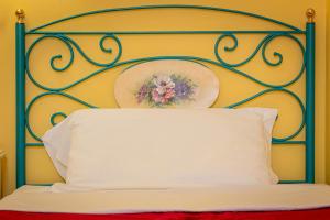 Voodi või voodid majutusasutuse Hotel Principi D'Acaja toas
