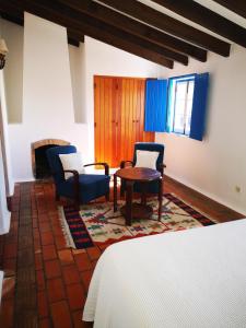 En eller flere senge i et værelse på Monte da Pereira - Casa Rural em Espaço Tranquilo