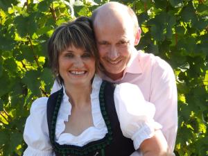 a man and a woman posing for a picture at Ferienweingut Matthias Löwen in Detzem