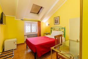 Voodi või voodid majutusasutuse Hotel Principi D'Acaja toas