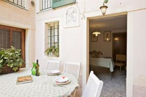 a table and chairs on a patio with a table and a dining room at Casa Maria Vittoria in Cannero Riviera