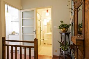 a hallway with a stairway leading to a bathroom at Casa Maria Vittoria in Cannero Riviera +106 photos