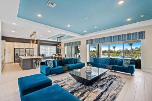 a living room with blue couches and a table at Bear's Den At Reunion Resort-TB024 in Kissimmee
