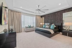 a bedroom with a bed and a ceiling fan at Bear's Den At Reunion Resort-TB024 in Kissimmee +74 photos