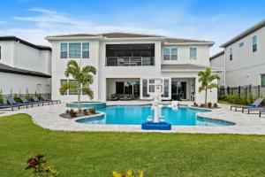 a house with a swimming pool in the yard at Bear's Den At Reunion Resort-TB024 in Kissimmee