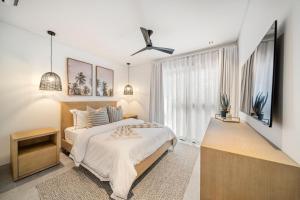 a bedroom with a bed and a large window at Allure 301 condo in Bridgetown