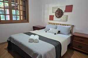 Postel nebo postele na pokoji v ubytování Refúgio de Lazer e Conforto + 63 fotografií