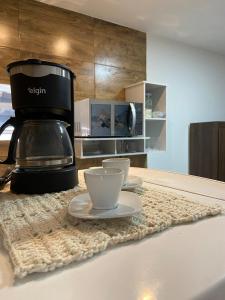 Η κουζίνα ή μικρή κουζίνα στο Flat Moderno IV - Próximo ao Centro +13 φωτογραφίες