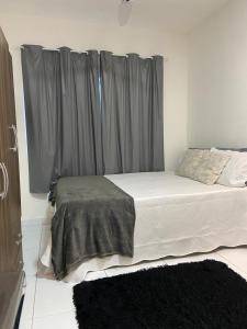 Ένα ή περισσότερα κρεβάτια σε δωμάτιο στο Flat Moderno IV - Próximo ao Centro