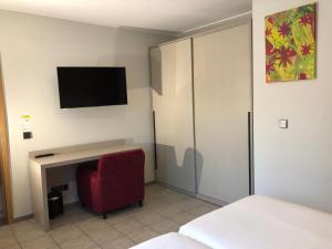 TV a/nebo společenská místnost v ubytování Appart-Hotel Gwendy