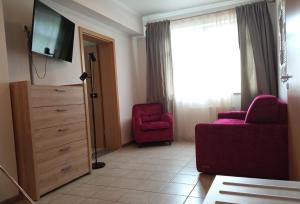 TV a/nebo společenská místnost v ubytování Appart-Hotel Gwendy