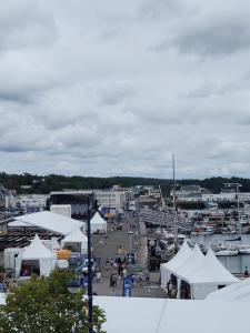 a harbor with white tents and a marina with boats at 3- Vue sur le port, la ville close, confort, WIFI in Concarneau