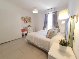 A bed or beds in a room at Pagliarulo Complex by AMALFIVACATION