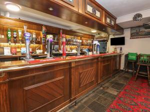 a bar in a pub with a red carpet at Sycamore Room in Seaham