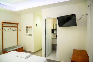TV a/nebo společenská místnost v ubytování Hotel J&M