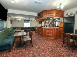 a restaurant with tables and chairs and a bar at Durham Castle Room in Seaham +26 photos