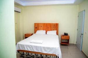 Postel nebo postele na pokoji v ubytování Hotel J&M
