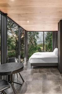 a bedroom with a bed and a table and chairs at Spino Fiorito Stay in Casola in Lunigiana +16 photos