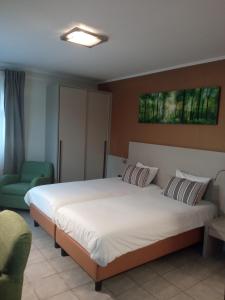 Postel nebo postele na pokoji v ubytování Appart-Hotel Gwendy