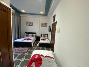 Postelja oz. postelje v sobi nastanitve Hotel Biarritz