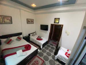Postelja oz. postelje v sobi nastanitve Hotel Biarritz
