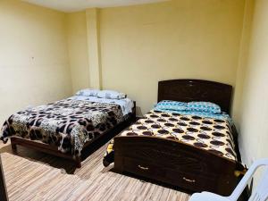 En eller flere senge i et værelse på Casa de huéspedes