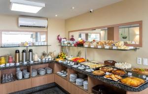 a buffet with many different types of food on display at Villa Park Hotel Fortaleza in Fortaleza