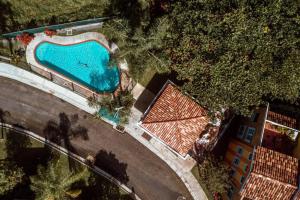 an overhead view of a swimming pool next to a building at Landing View 204 with private rooftop terrace in Rincon