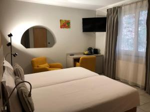 Postel nebo postele na pokoji v ubytování Appart-Hotel Gwendy