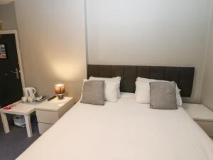 Ένα ή περισσότερα κρεβάτια σε δωμάτιο στο Lyndasfarne Room