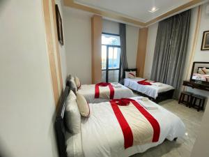 Postelja oz. postelje v sobi nastanitve Hotel Biarritz