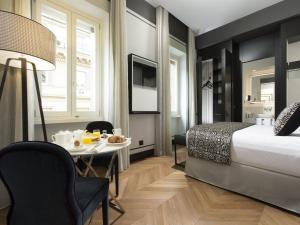 Postel nebo postele na pokoji v ubytování Corso 281 Luxury Suites