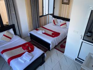 Postelja oz. postelje v sobi nastanitve Hotel Biarritz