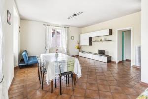 a kitchen and dining room with a table and chairs at La Veduta in Cannobio