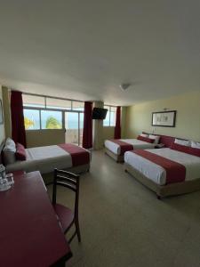 Postel nebo postele na pokoji v ubytování Hotel Royalty