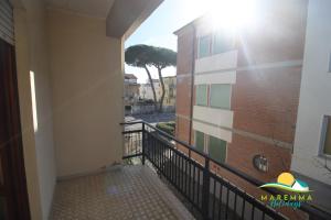 a balcony with a view of a building at Pratoranieri - Sparviero in Follonica