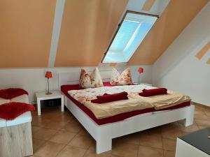 a bedroom with a large bed with a window at Dünenvilla 2 Thiessow in Thiessow