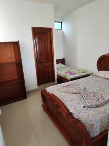Postel nebo postele na pokoji v ubytování Hotel South Beach Atacames