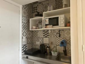 Kuchyň nebo kuchyňský kout v ubytování Maipu Apartment Studio