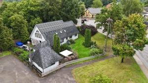 an overhead view of a house with a roof at Guest House ALEJA in Myza Bene