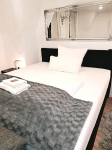 Ένα ή περισσότερα κρεβάτια σε δωμάτιο στο Enjoy Dresden Appartement