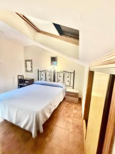 Ένα ή περισσότερα κρεβάτια σε δωμάτιο στο Hostal San Martin
