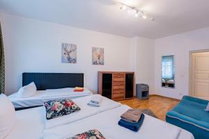 En eller flere senge i et værelse på Great Central City Apartments Mitte Rosenthaler Platz