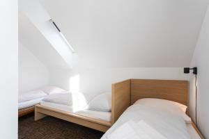Ένα ή περισσότερα κρεβάτια σε δωμάτιο στο Apartmán Cubik Boží Dar