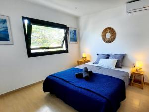 Voodi või voodid majutusasutuse Superbe 2 chambres avec piscine toas