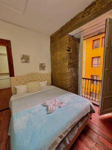 Postel nebo postele na pokoji v ubytování Casa Cordoba