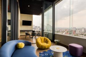 a living room with a view of a city at Resort Home with Extraordinary City View in Mexico City
