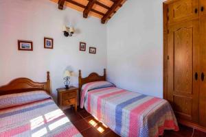 Postel nebo postele na pokoji v ubytování Vivienda Rural Atlántico Sur & Familias