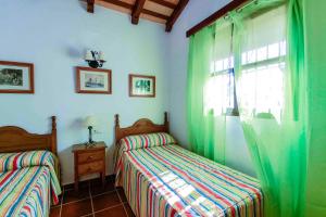 Postel nebo postele na pokoji v ubytování Vivienda Rural Atlántico Sur & Familias